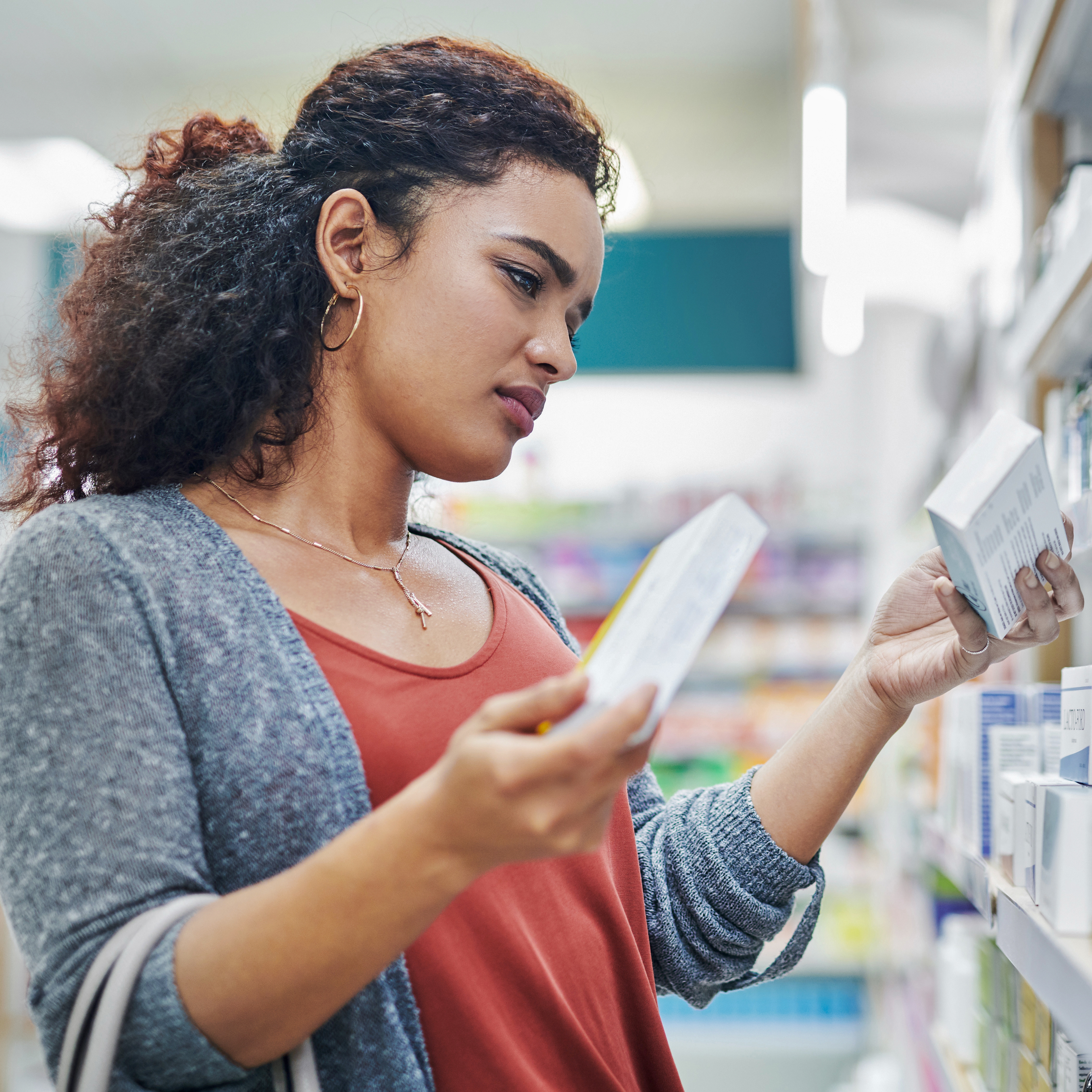 Woman shopping for product in drug store
